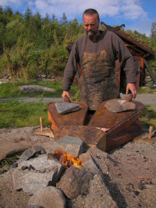 Ken Ravn Hedegaard working the bellos to melt bronze before a casting can be made