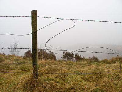 Broken fence with long drop beyond Broken fence with long drop beyond