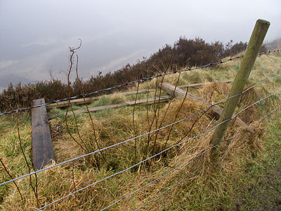 Yet another broken fence at the top of a cliff. Yet another broken fence at the top of a cliff.