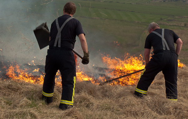 The Brigade working hard to contain a grass fire reported by one of the Friends of Crompton Moor The Brigade working hard to contain a grass fire reported by one of the Friends of Crompton Moor
