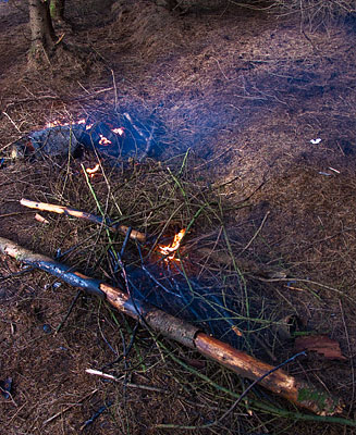 The remains of the fire still burning. The remains of the fire still burning.
