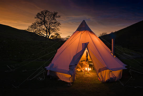 Even a large tent can enjoy the cheery glow of a wood stove and a few candles. -  2017 - Gary Waidson - Ravenlore