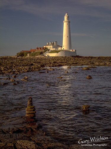 St. Mary's Island Lighthouse and small stack. Landscape photography by Gary Waidson. St. Mary's Island Lighthouse and small stack. Landscape photography by Gary Waidson.